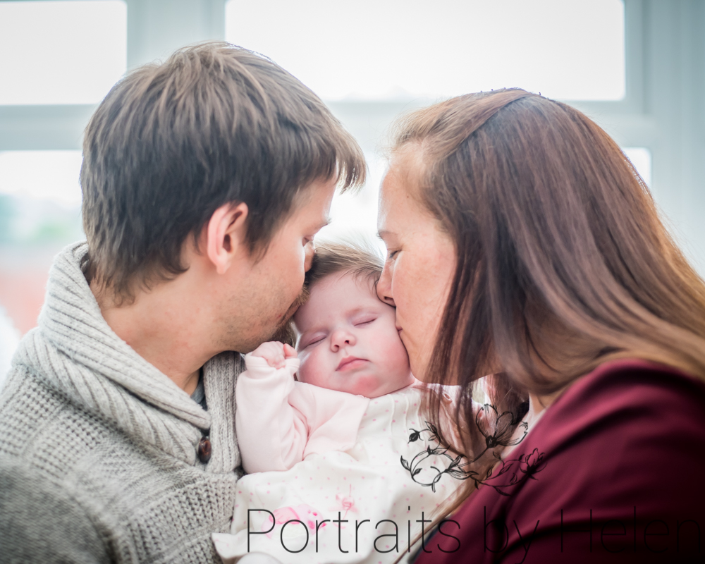 Kissing baby, newborn photographer Cumbria