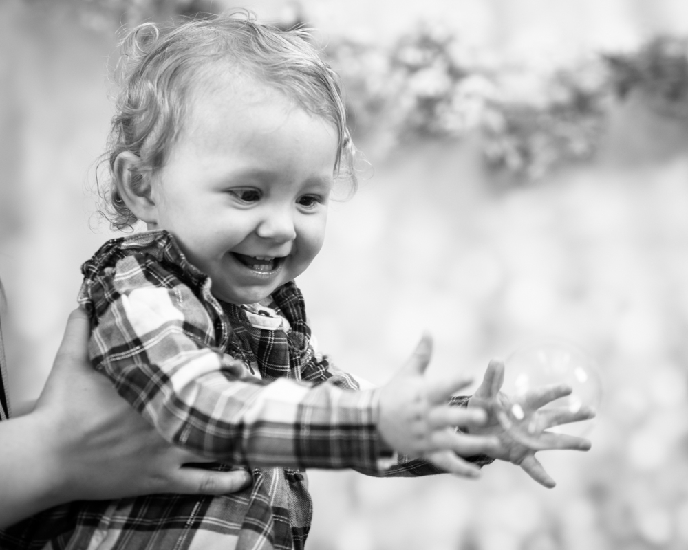 Popping bubbles, baby photographer Carlisle