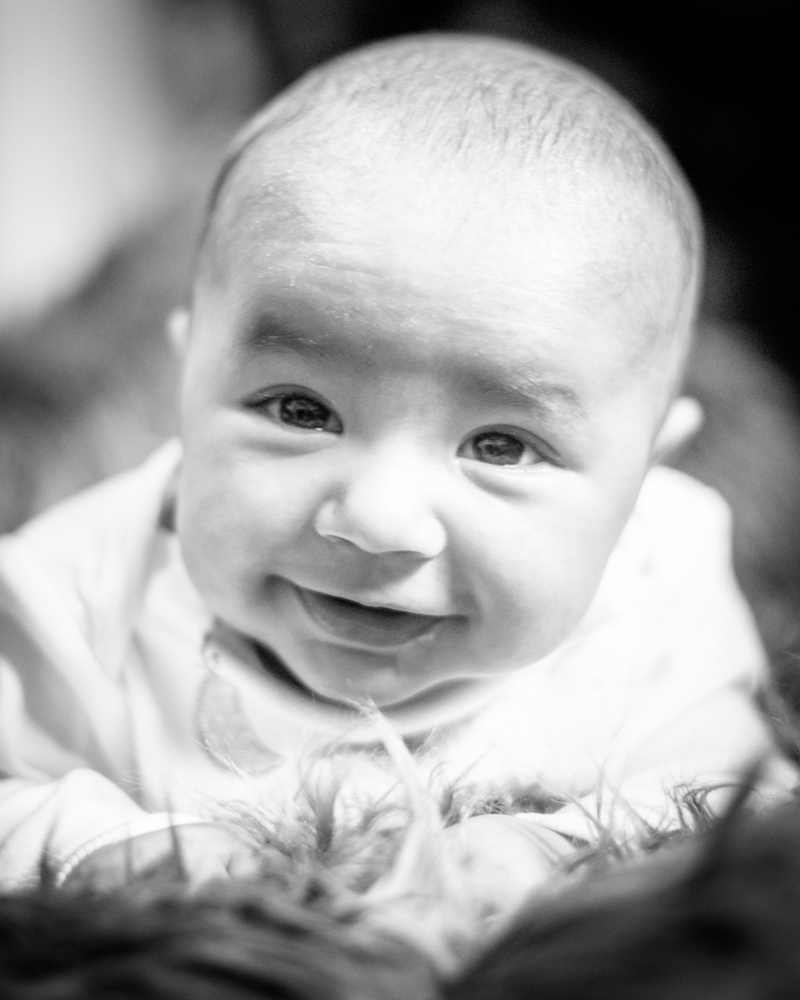 Smiling baby Amman, newborn photographer Lake District