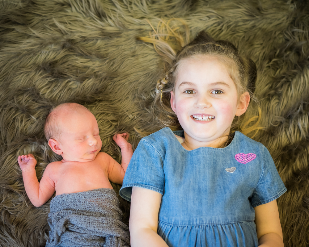 Baby and sister, cumbria newborn photographer