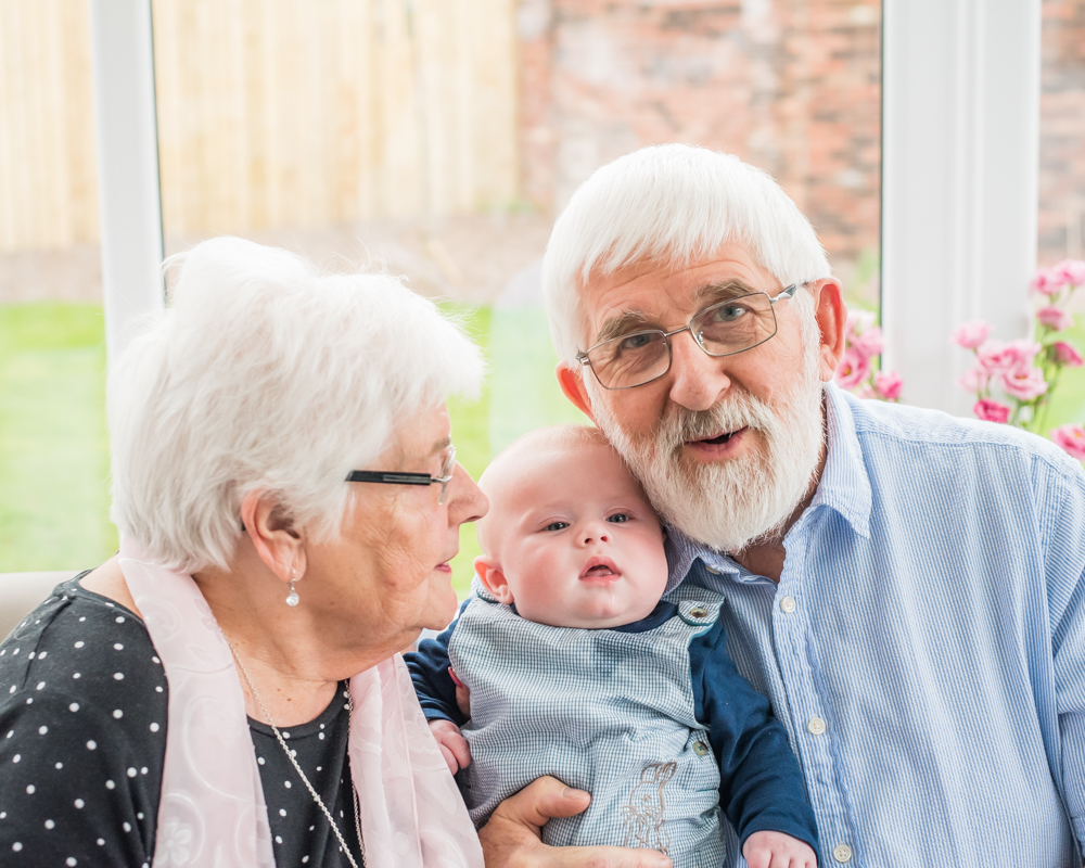 Cuddles with grandparents, baby photographer Cockermouth