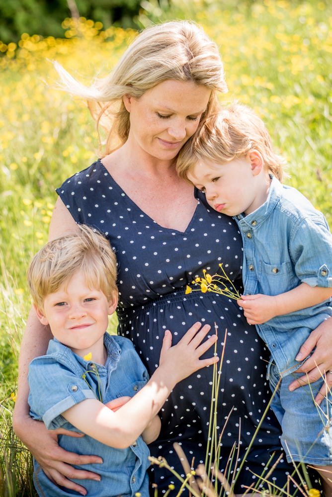 Cuddles with Mum and buttercups, baby photographer Cockermouth