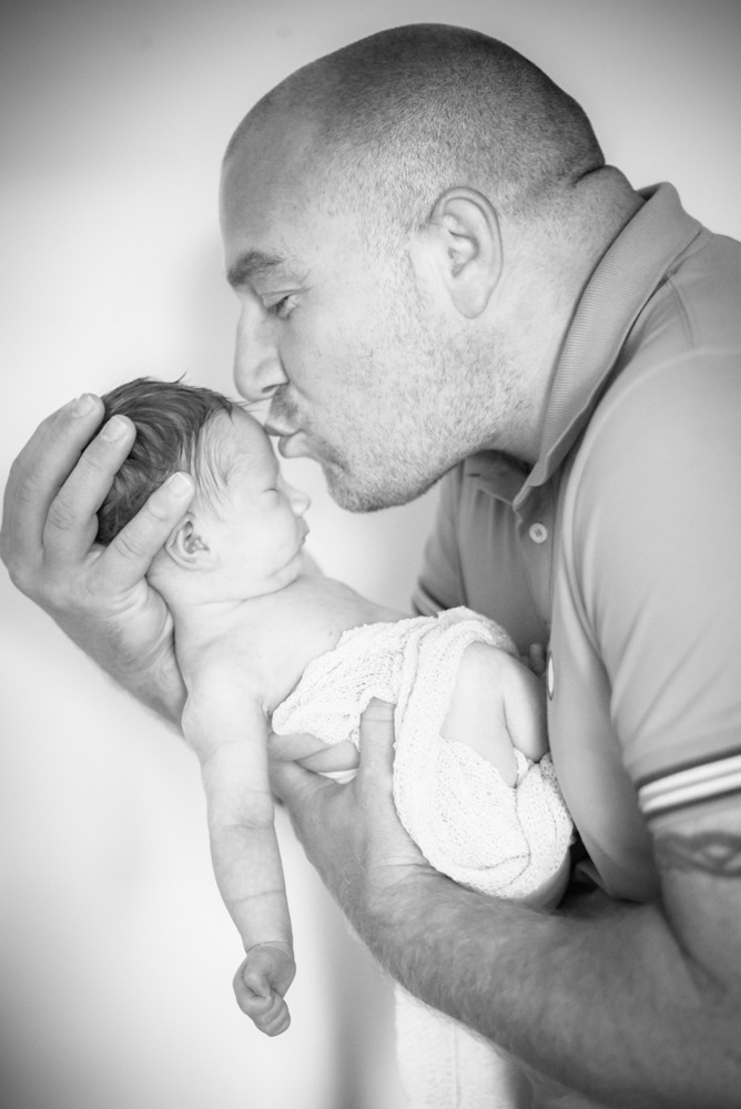 Dad kissing baby boy, baby portraits Wigton