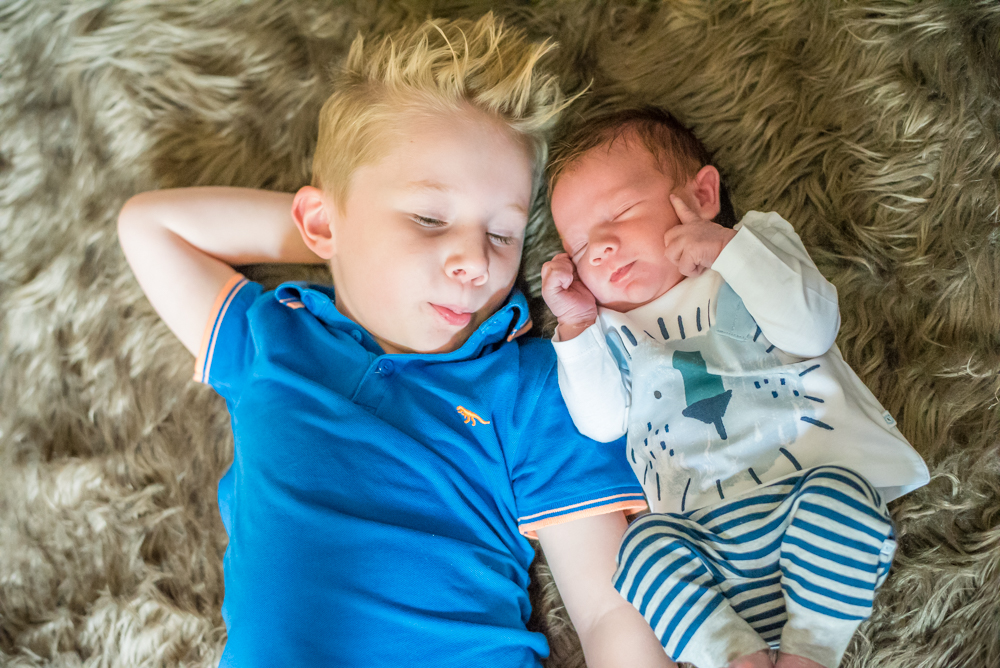 Brothers snuggled together, baby photographers Bothel