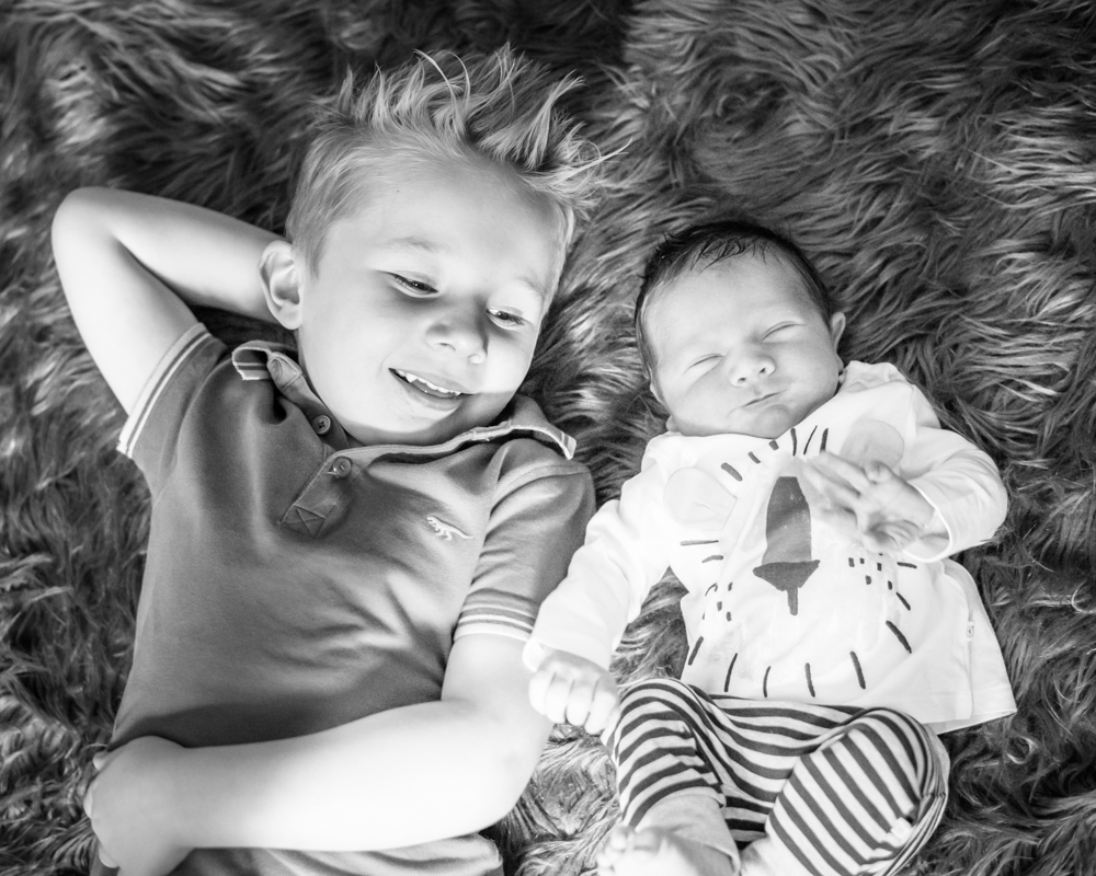 Smiling baby and brother, Fletchertown photographers