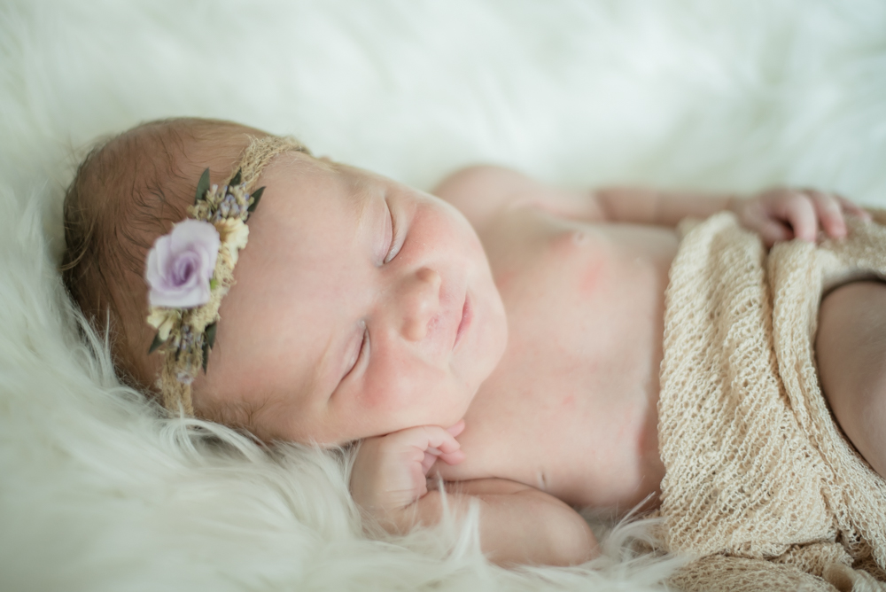 Sleepy baby posing, newborn photographer Cumbria
