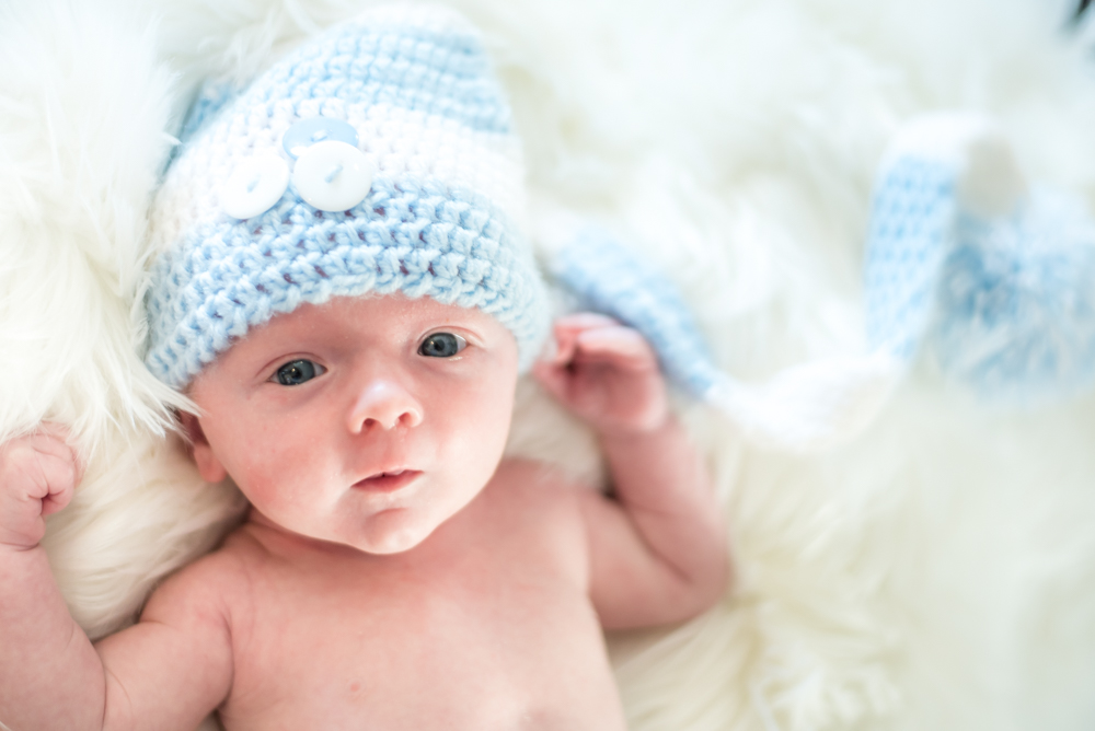 Cute Freddie in long hat, newborn portraits Workington