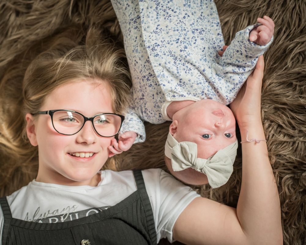 Baby and big sister posing, baby photographer Carlisle
