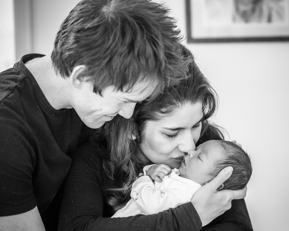 Mum and Dad cuddling baby, newborn portraits Windermere