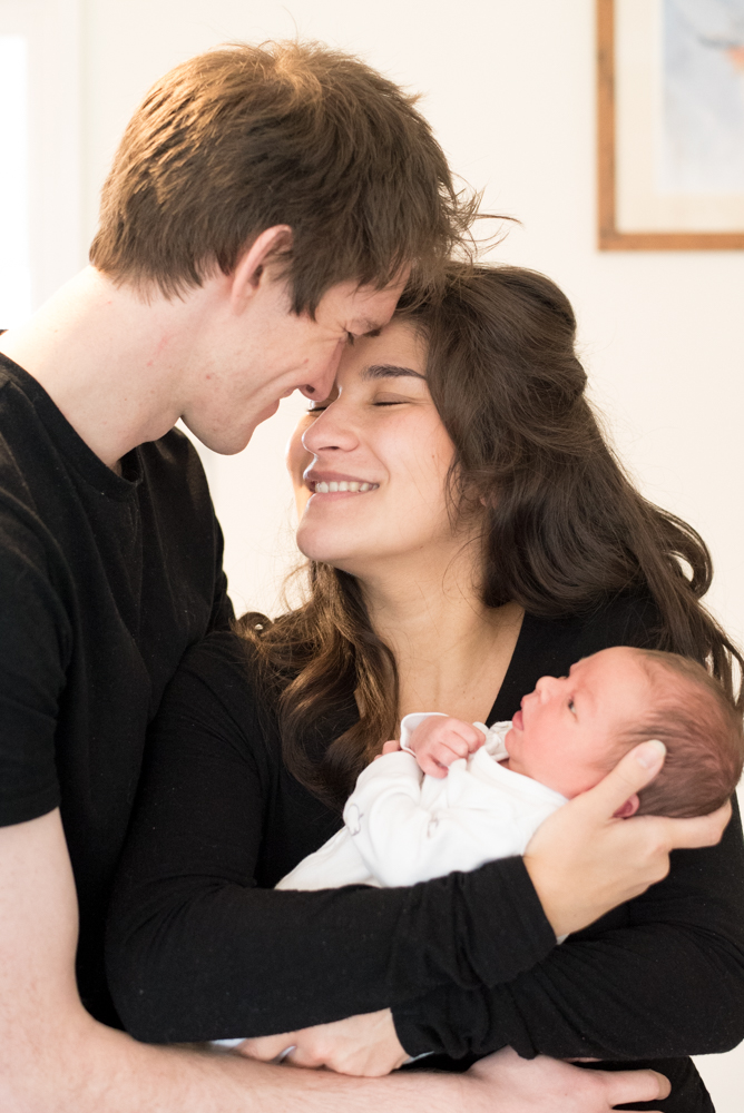Mum and Dad nose to nose with baby, reportage newborn portraits
