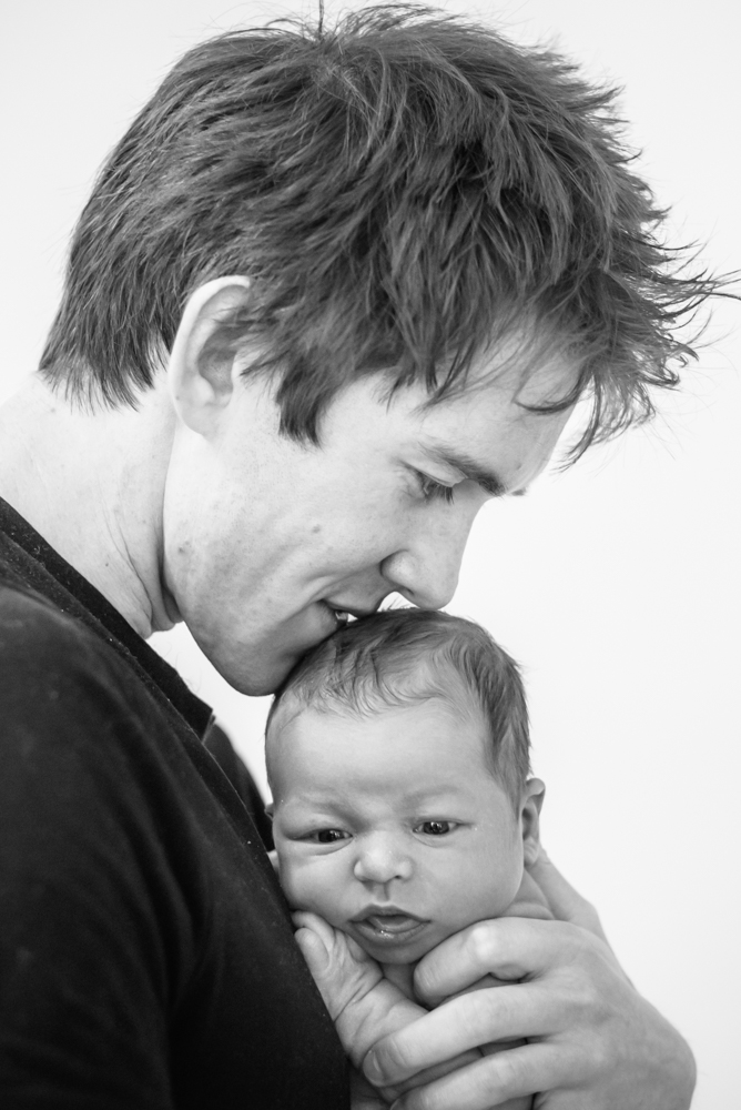 Dad kissing baby, newborn portraits Cumbria